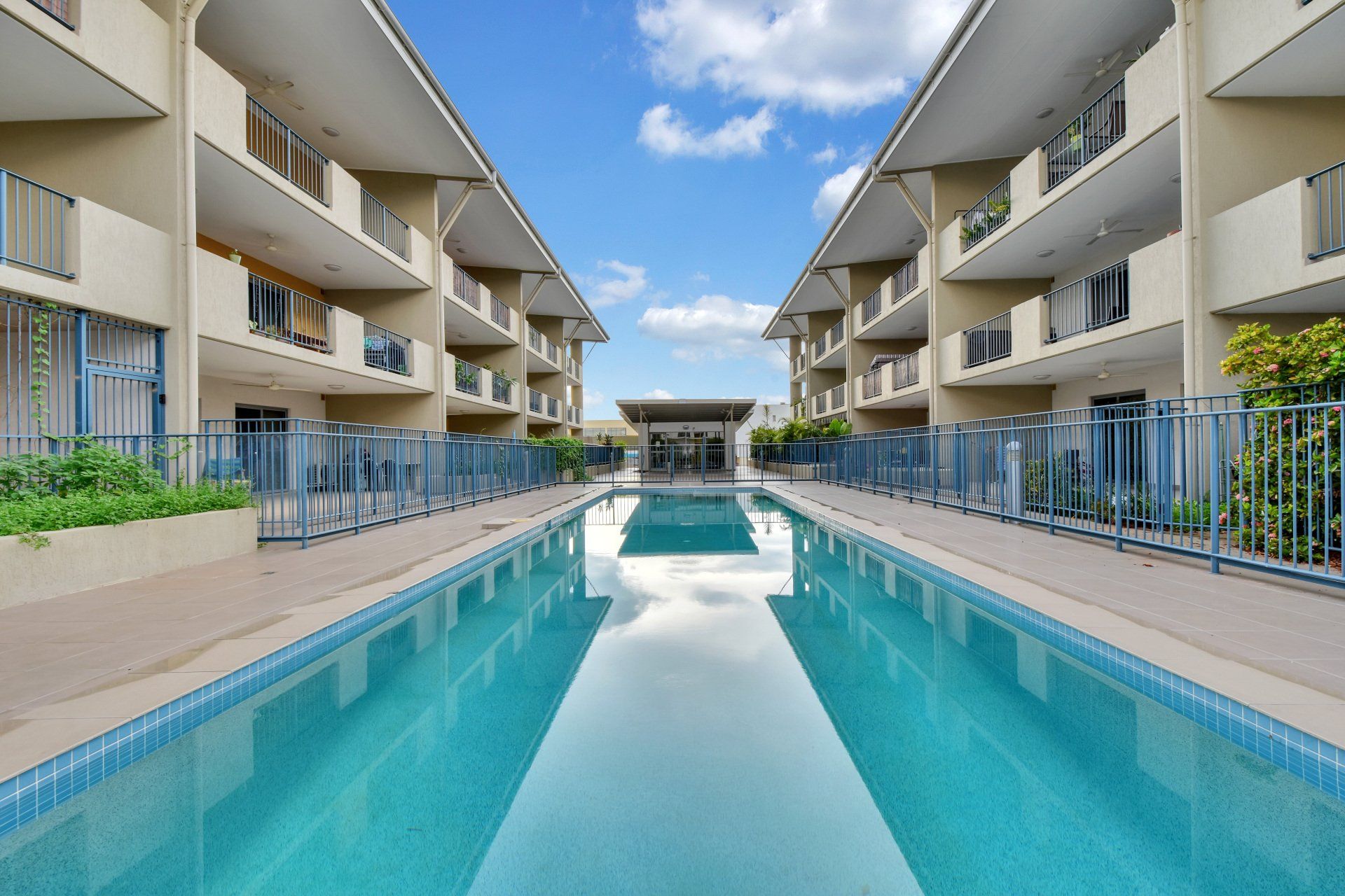 A large swimming pool in the middle of a building