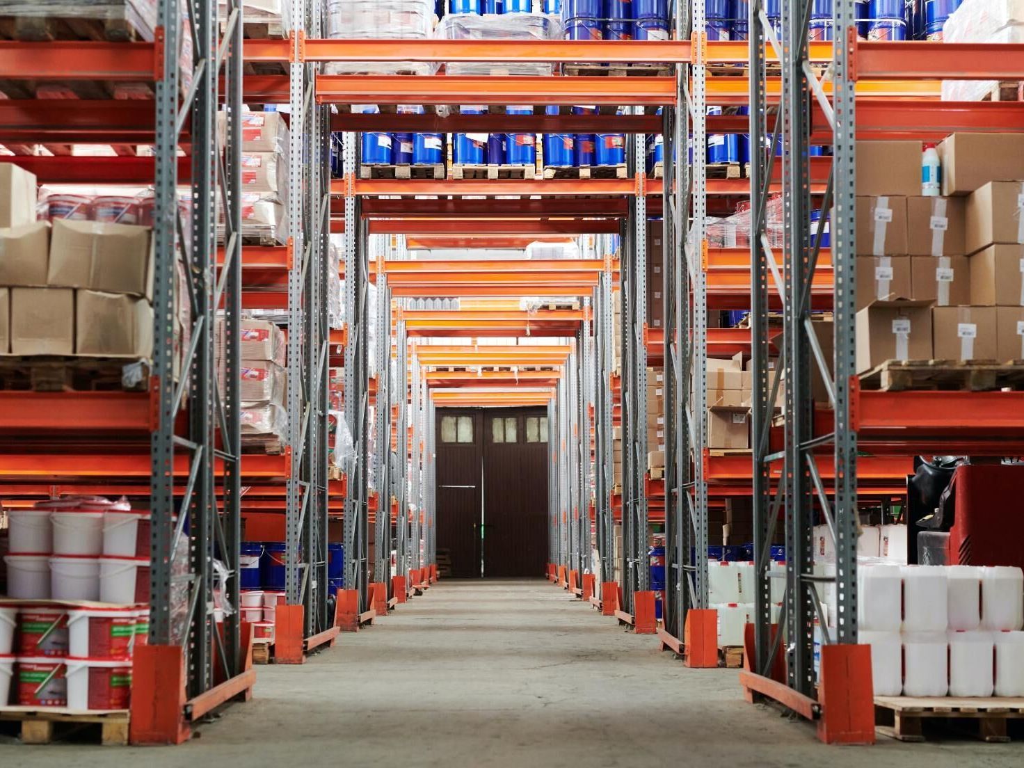 a large warehouse filled with lots of shelves and boxes .