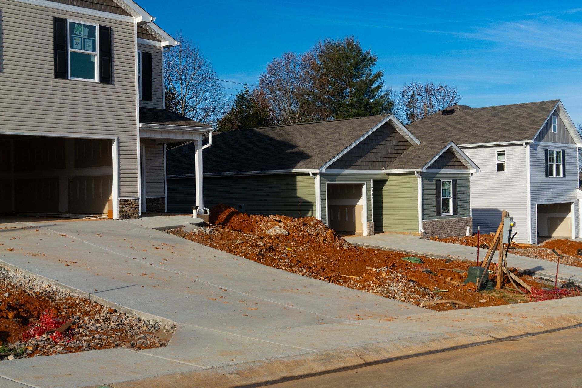 A row of houses are being built in a residential neighborhood.