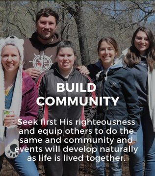 A group of people are posing for a picture and the caption says build community