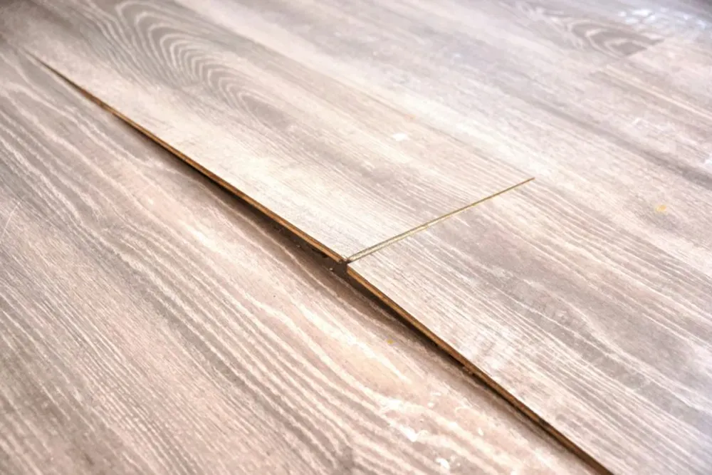 Buckling vinyl plank flooring.