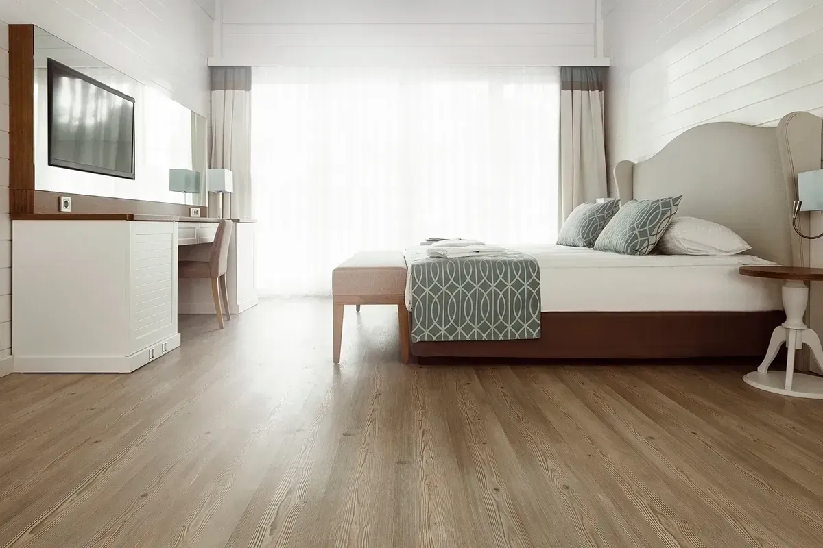 Cheap laminate flooring in a hotel room.