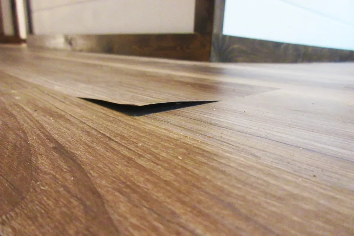 An example of engineered hardwood flooring brands to avoid due to poor quality.