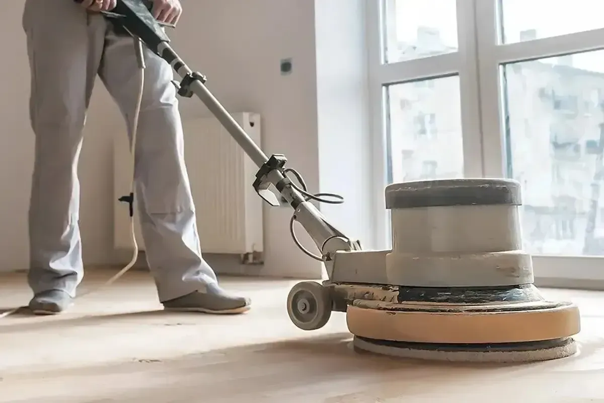 Flooring contractor in Portland, Rejuvenation Floor & Design, sanding a floor.