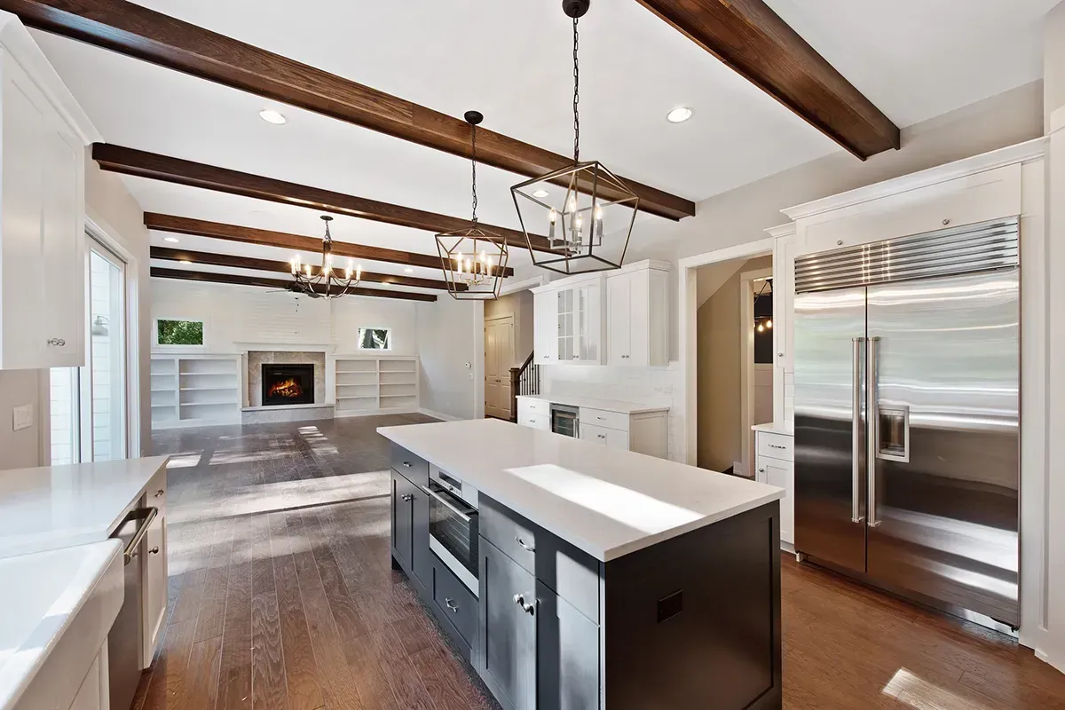 Contractors in Portland showing new flooring in a spacious home.