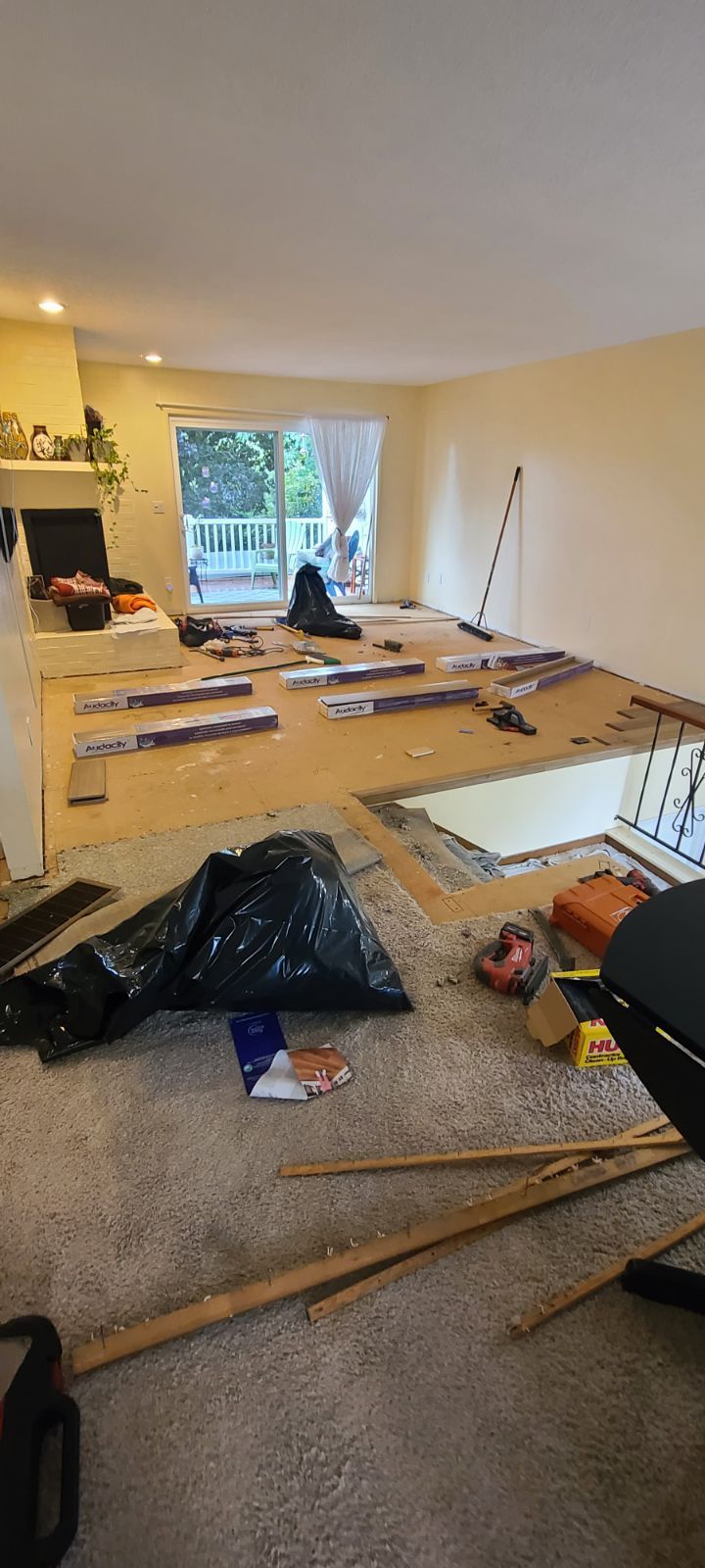 Preparing flooring for new floor installation.