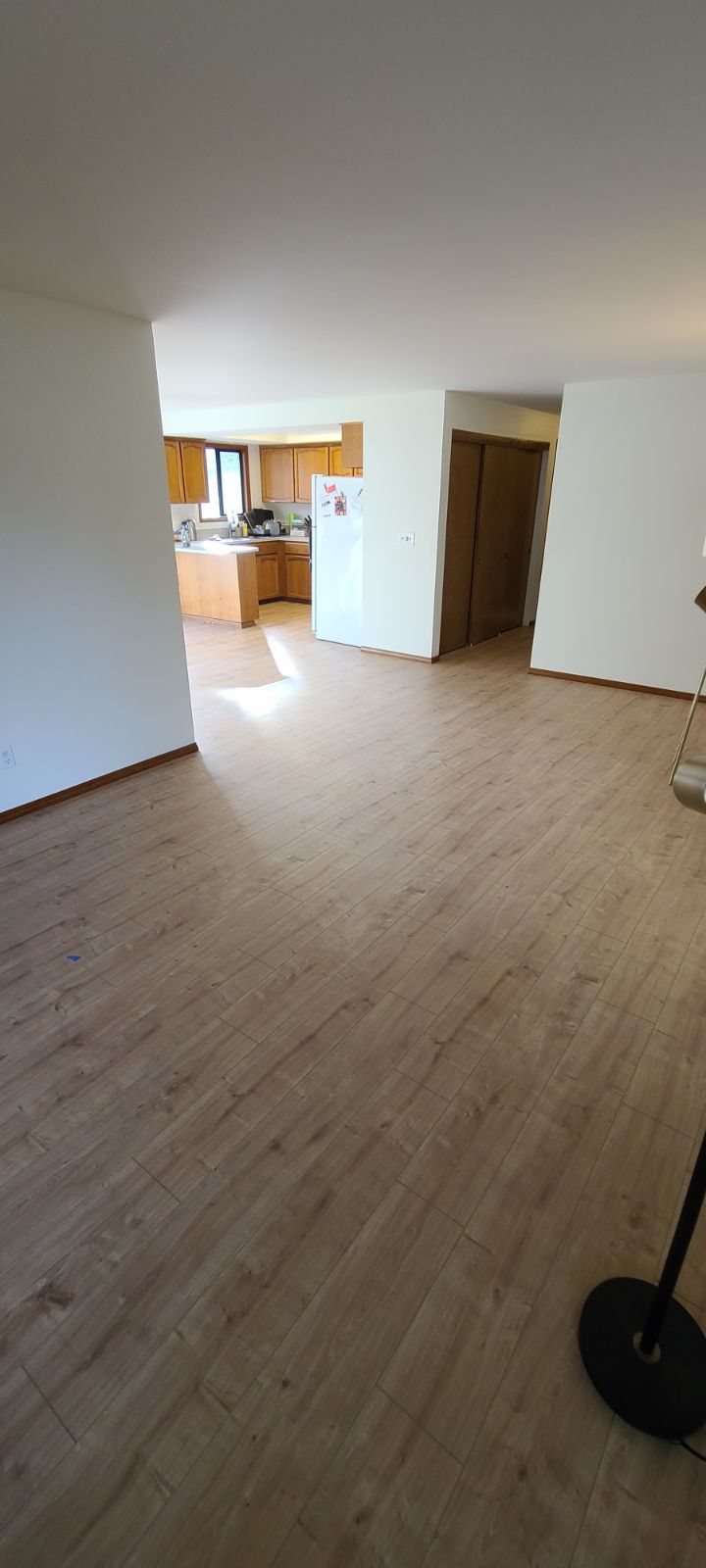 Living room after Orca laminate flooring installation.