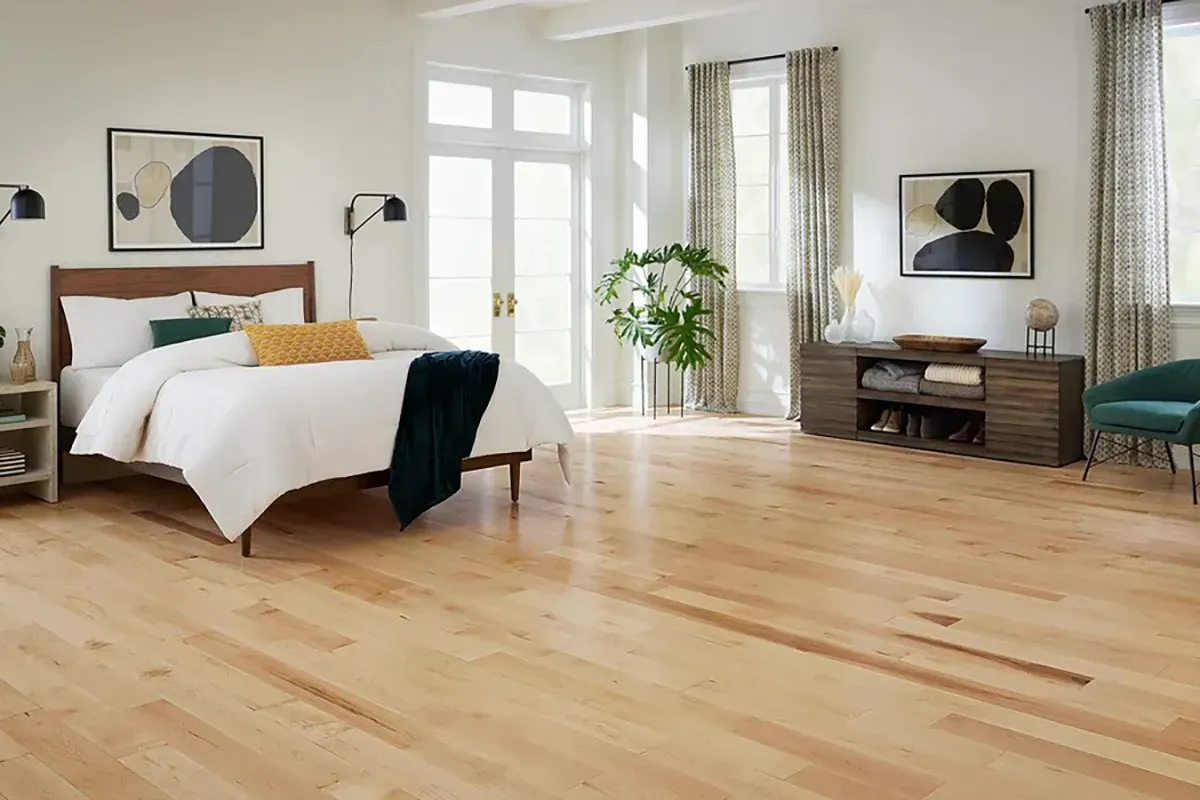 Maple flooring in a bedroom.