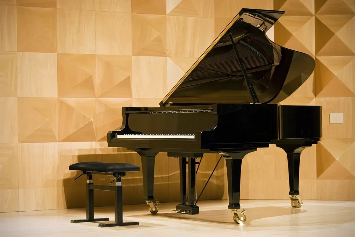 Piano sitting on top of ma flooring.