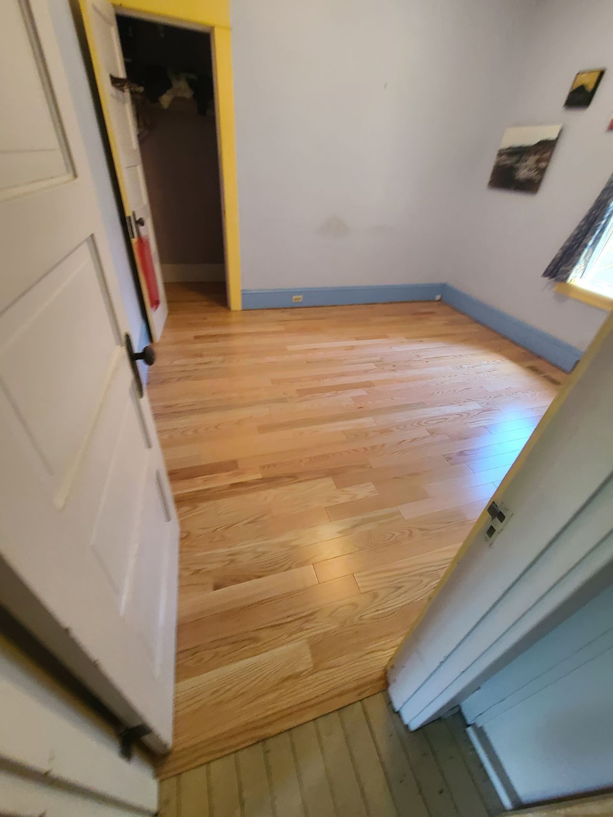 Room with newly installed natural red oak flooring in Portland, OR.