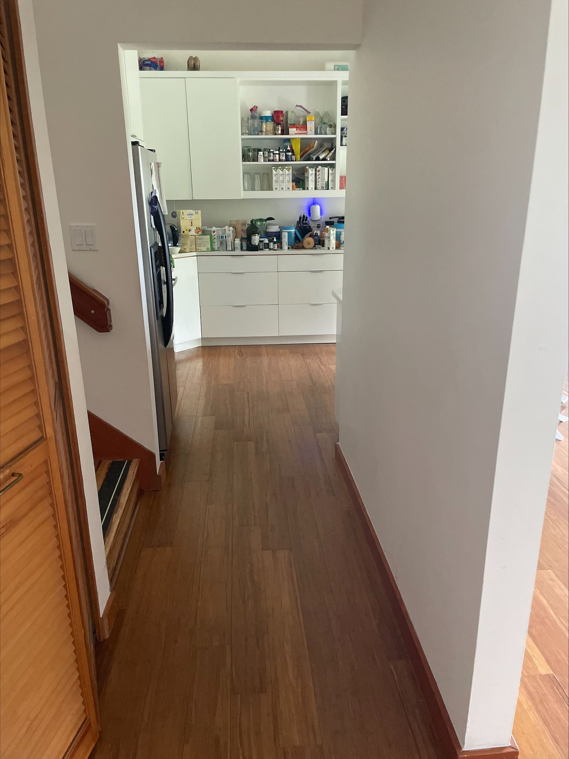 Floating bamboo flooring in hallway.