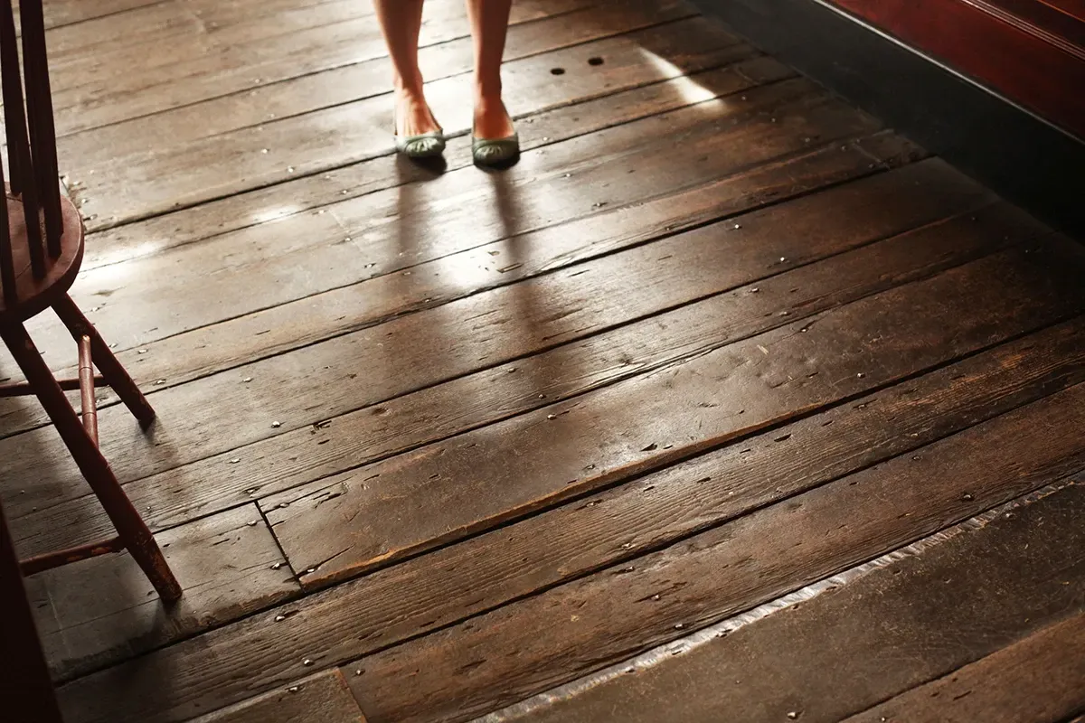 Woman standing on a squeaky wood floor.