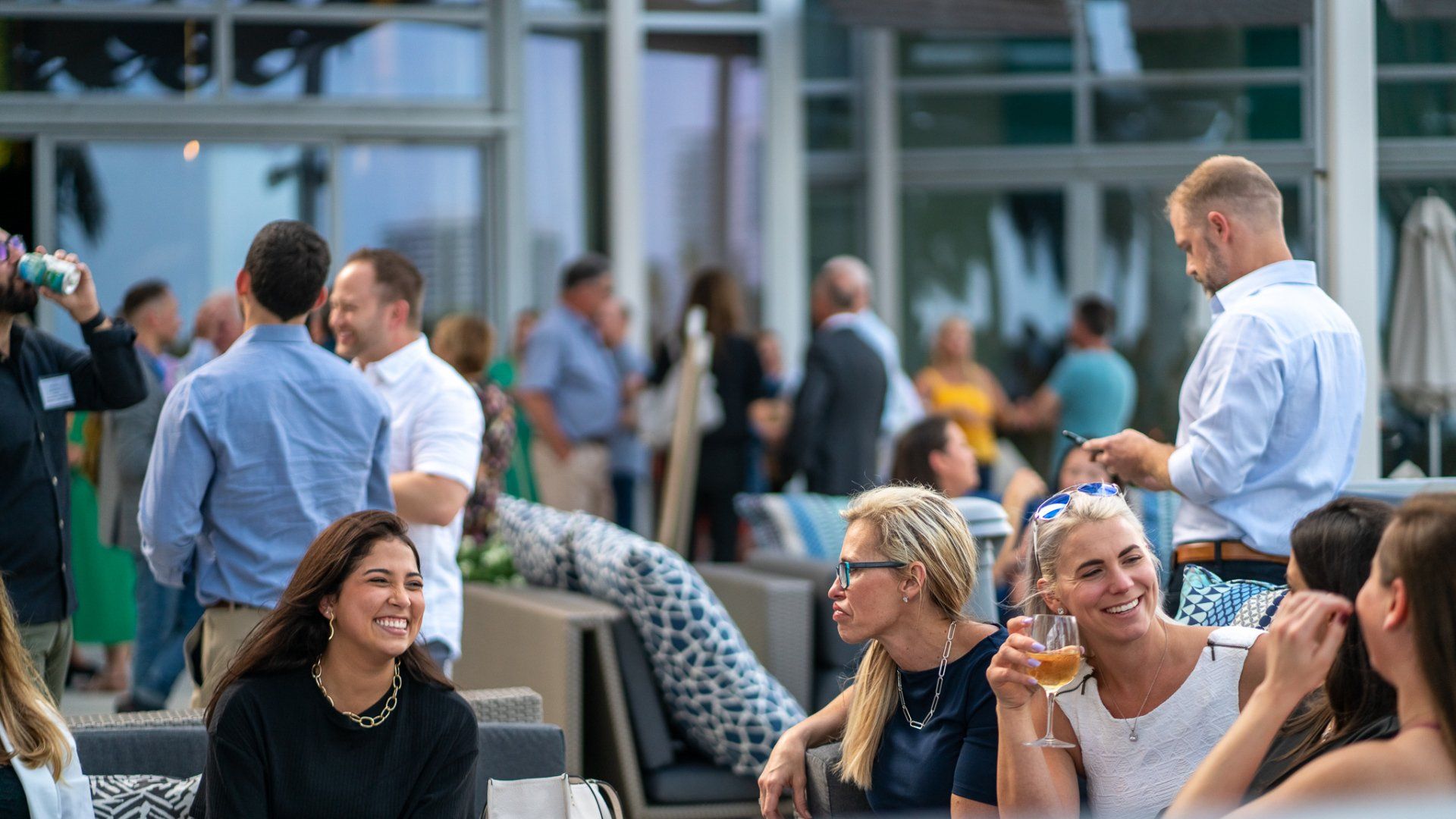 A group of people are sitting around a table at a party.
