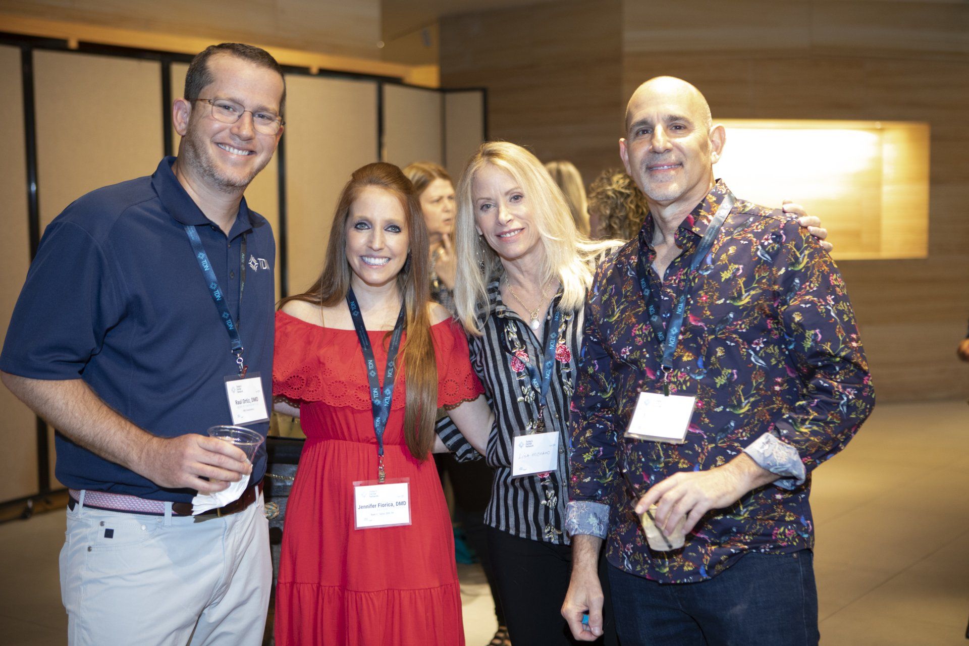 A group of people are posing for a picture in a room.