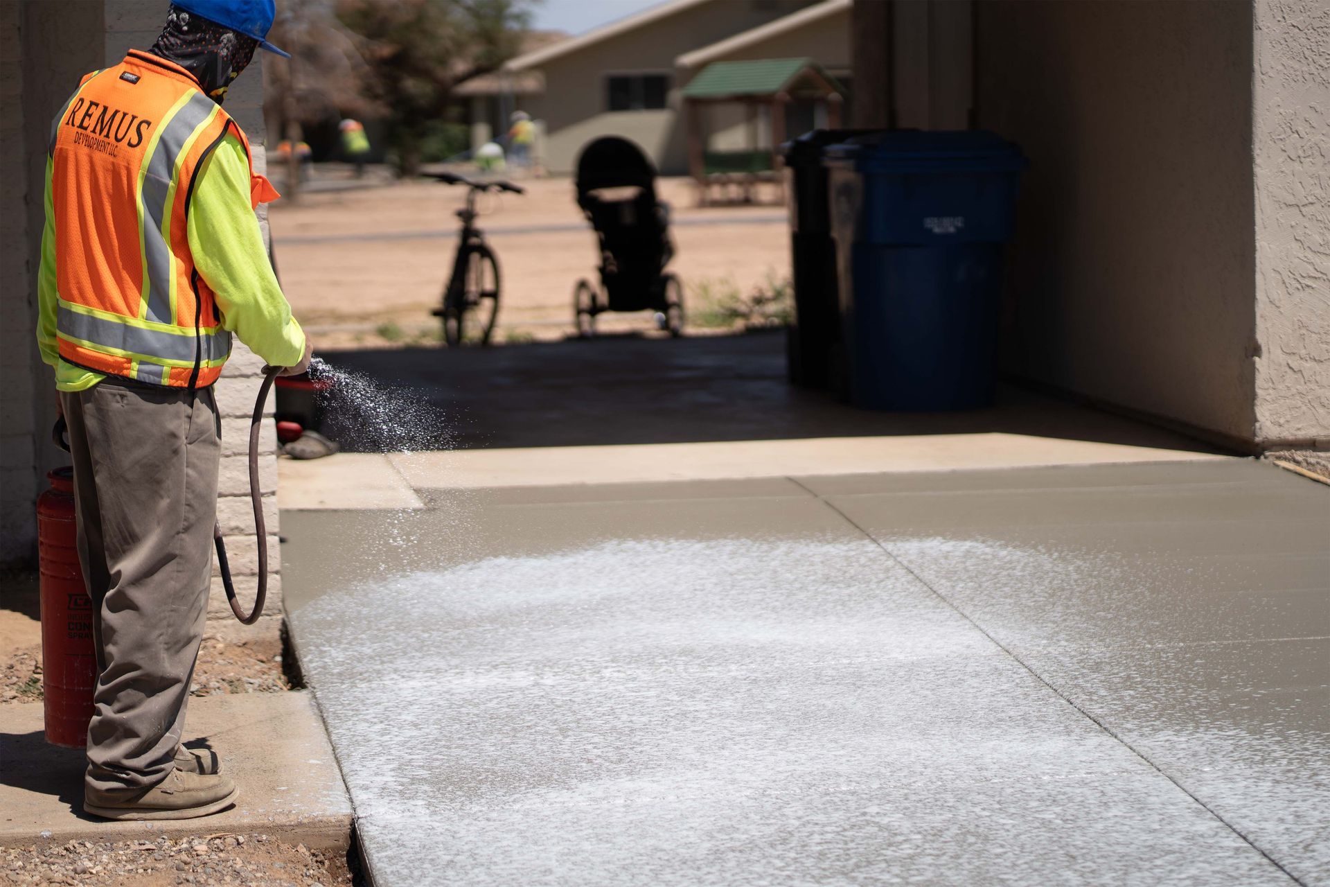 A white house with a table and chairs in front of it