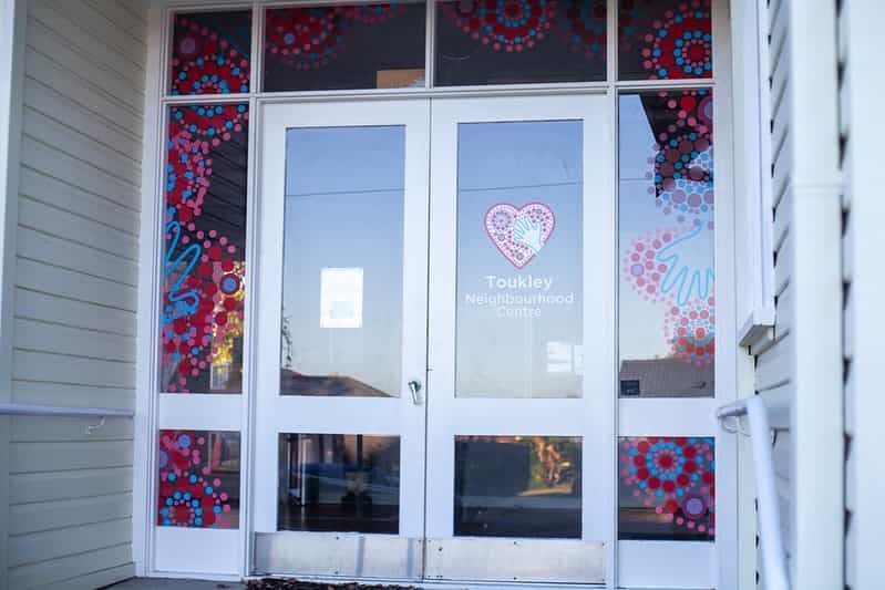 The Front Door Of A Building With A Heart On It — Solis Signs in Toukley, NSW