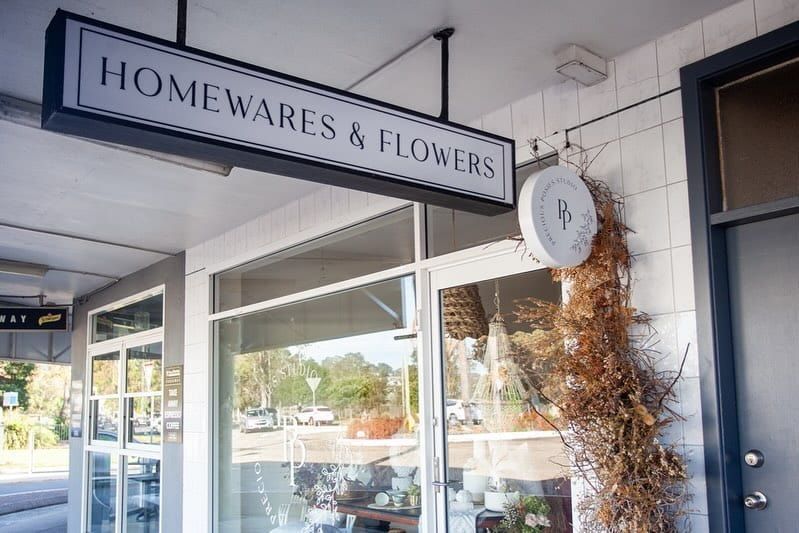 The Front Of A Homewares And Flowers Store With A Sign Above The Door — Solis Signs in Toukley, NSW