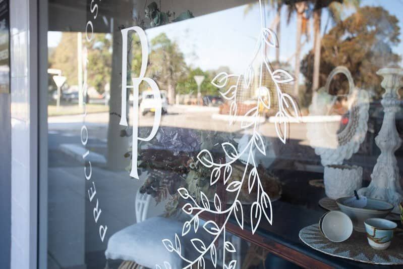 A Window With A Drawing Of A Tree On It — Solis Signs in Toukley, NSW