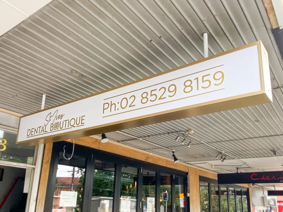 The Front Door Of A Building With A sign — Solis Signs in Toukley, NSW