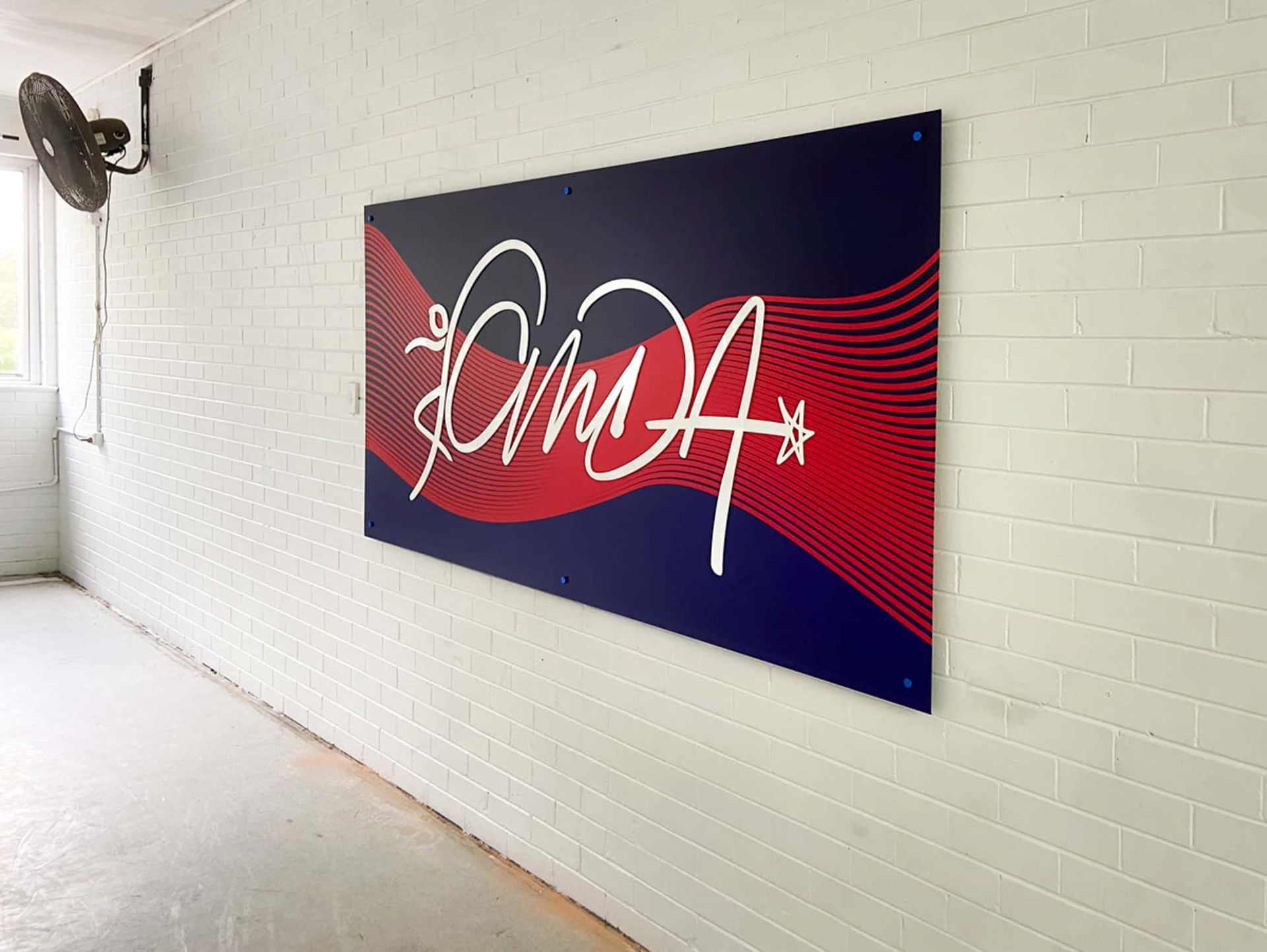 A White Brick Wall With A Sign That Says Oma On It — Solis Signs in Toukley, NSW