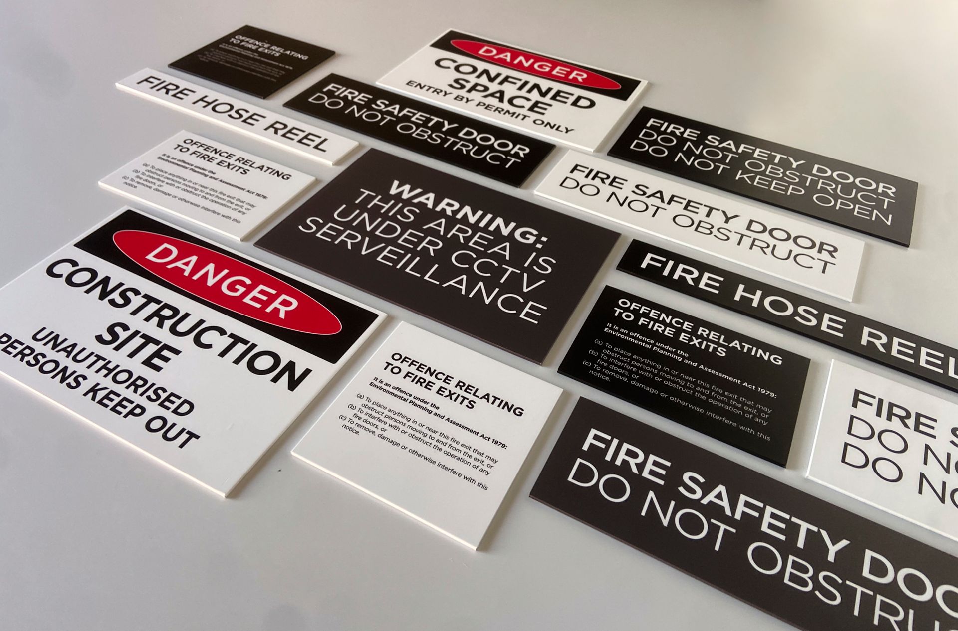 Safety signs printed and placed all together to showcase work — Solis Signs in Toukley, NSW