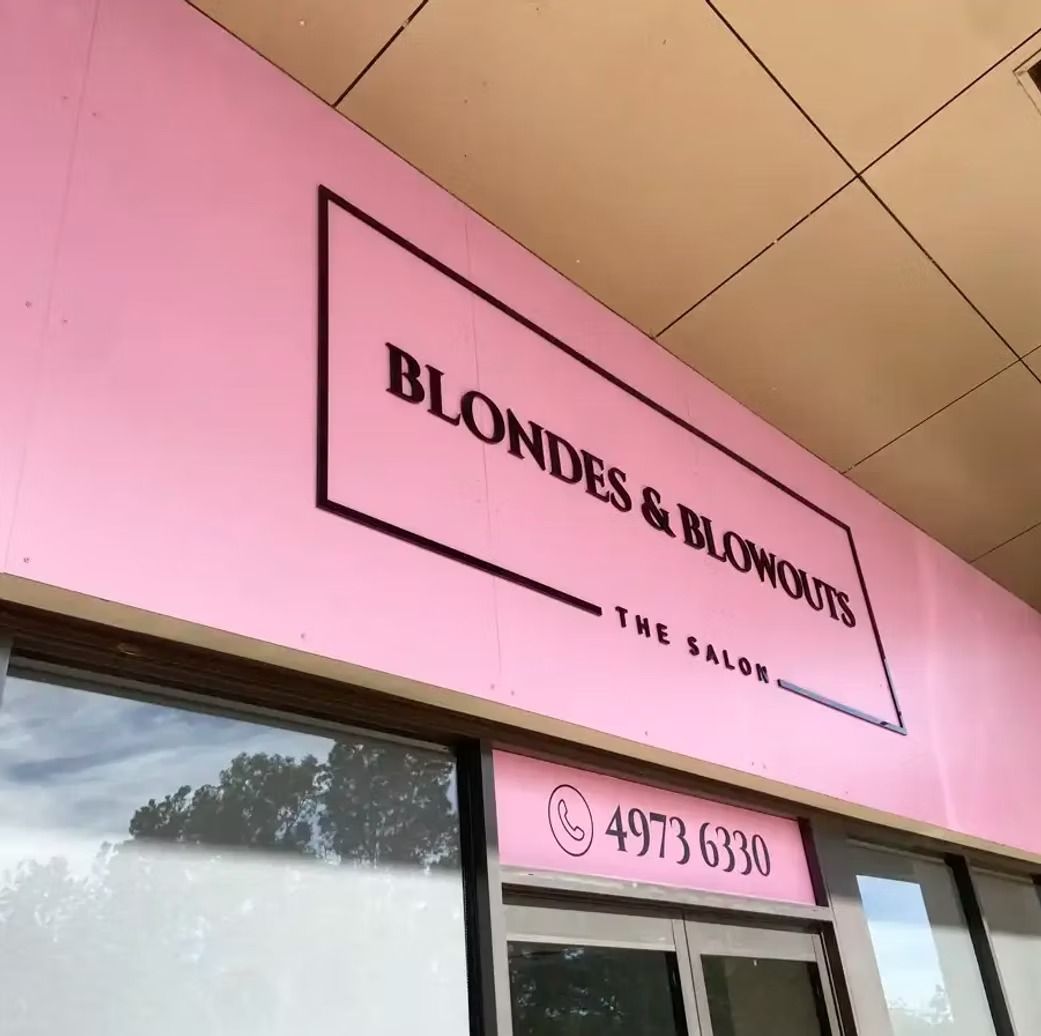 A Large Building With A Sign On The Side — Solis Signs in Toukley, NSW