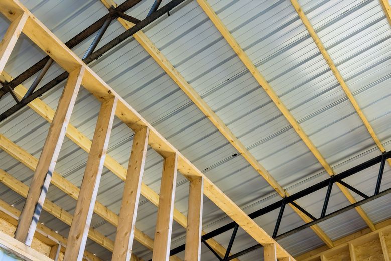 Wooden frame construction with metal roofing.