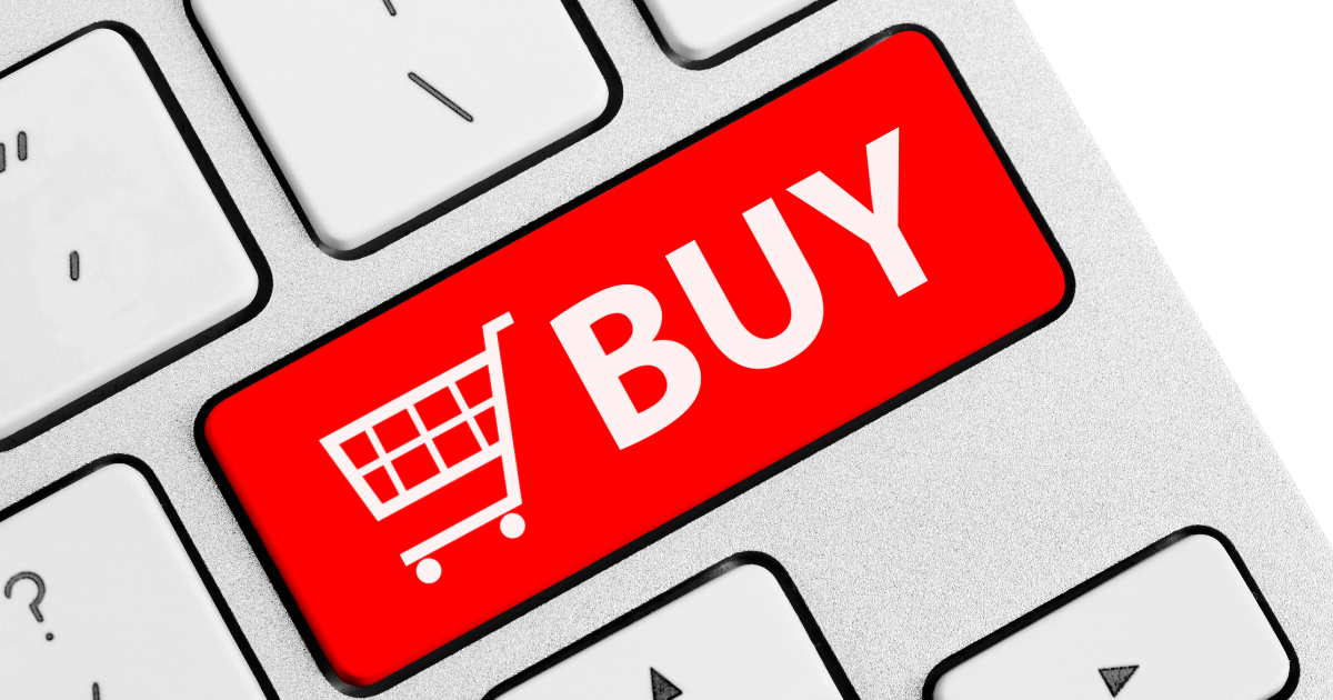 Close-up of a red keyboard key with a shopping cart icon and the word