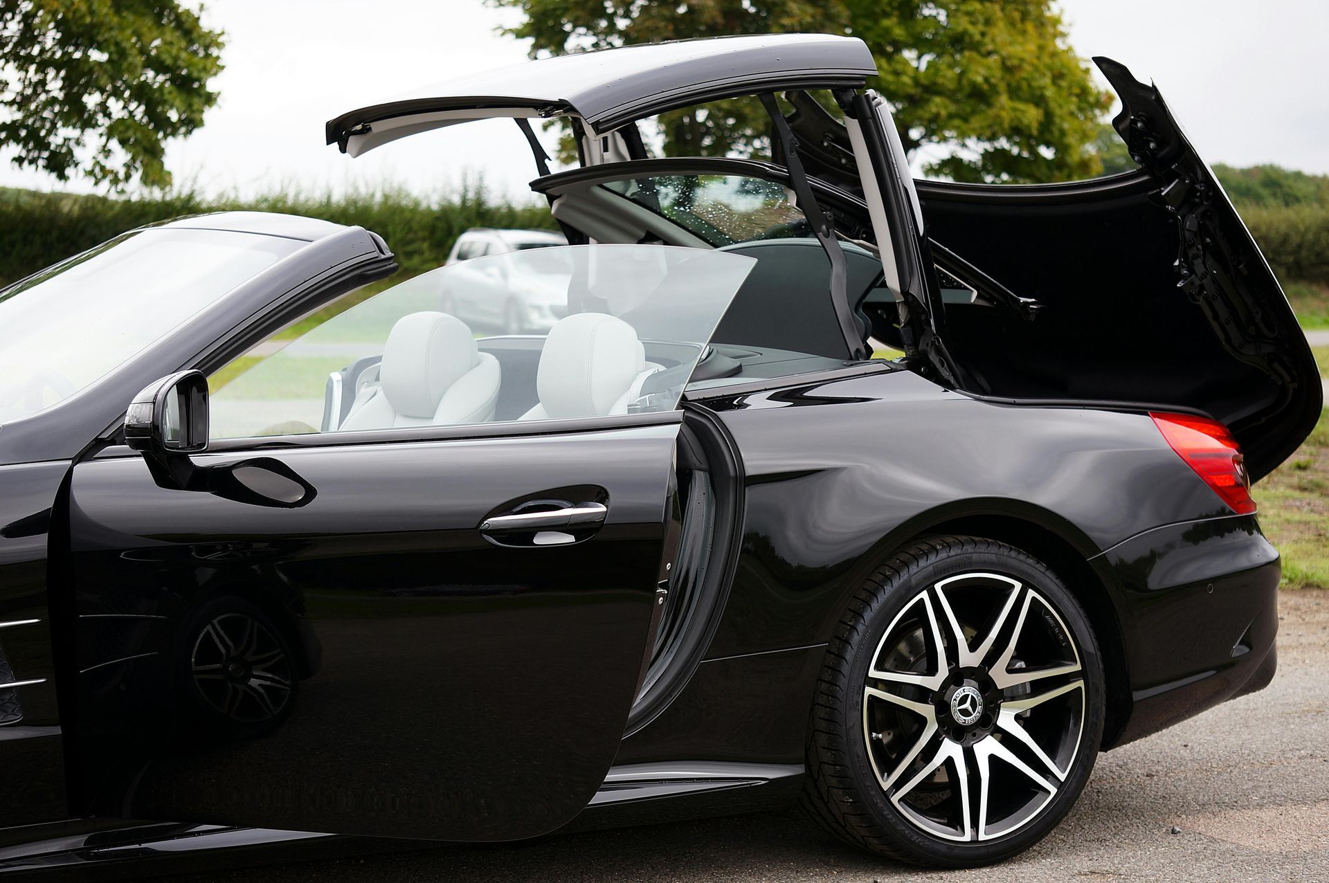 A yellow sports car is parked in a parking lot