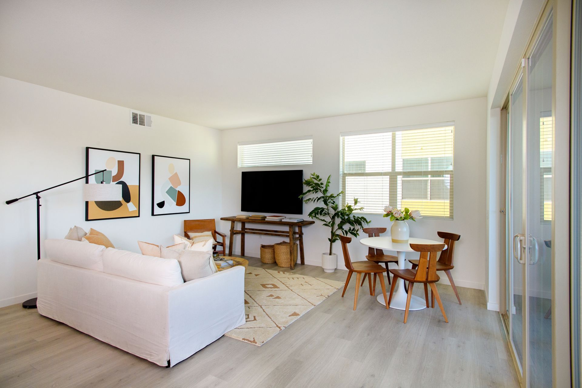 photo showing the living room area with plenty of natural lighting