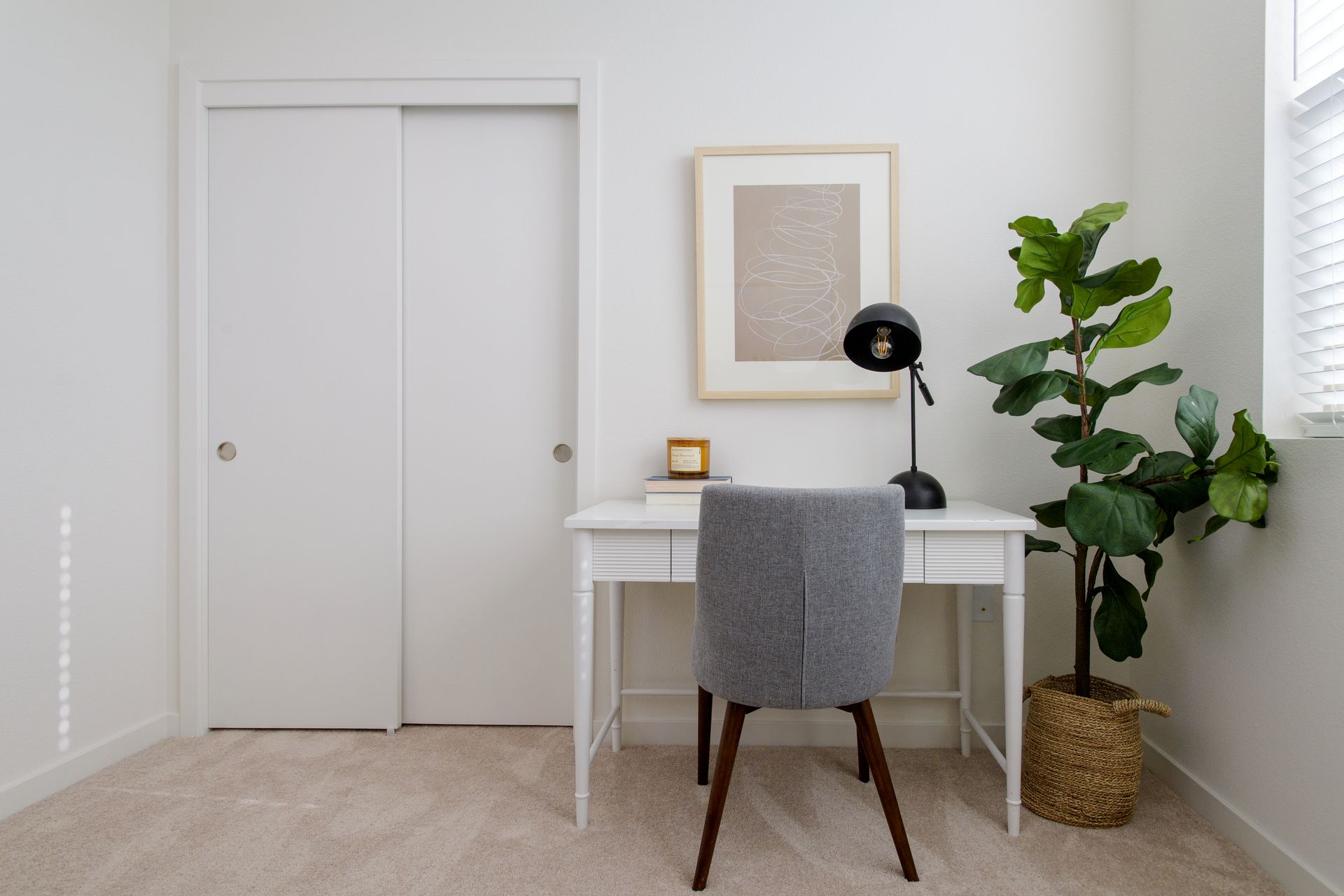 photo showing desk in a room with plenty of natural lighting
