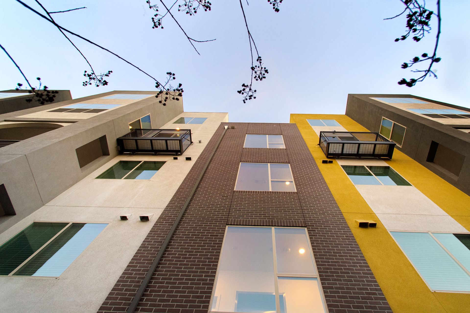 Building seen from street view looking up and showing multi-color scheme