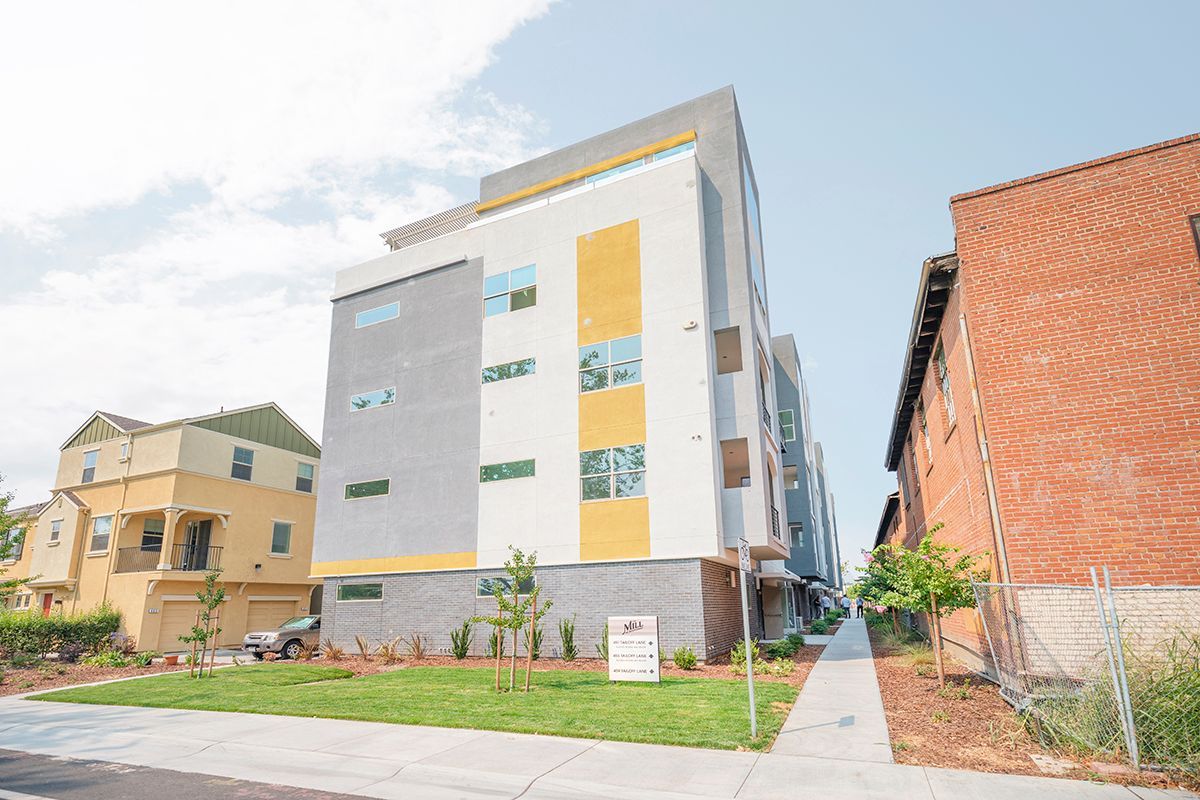 photo showing the building, walkway and grassy area