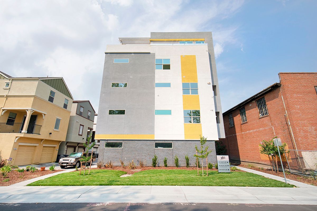 photo showing the building from the side with grassy area