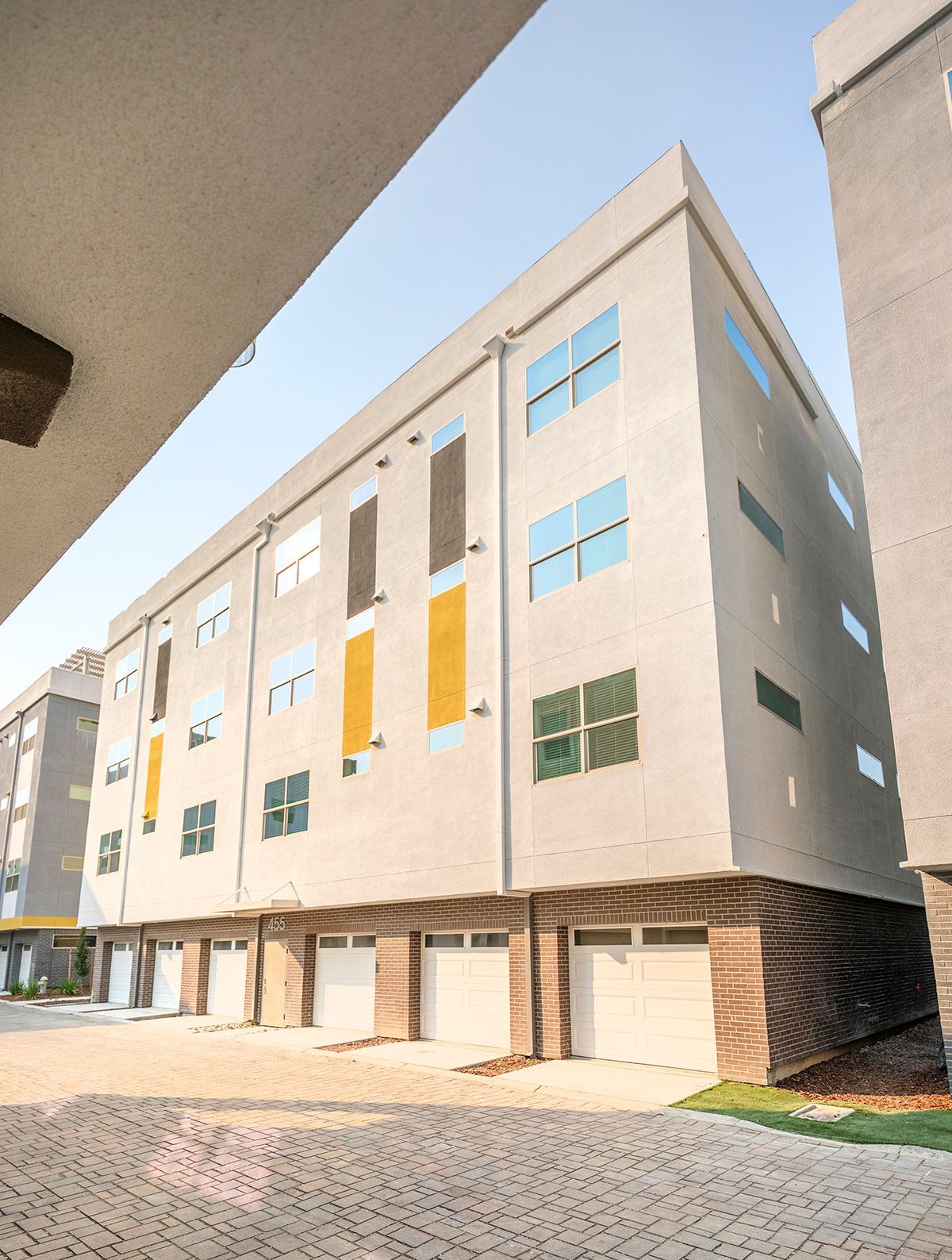 photo showing the building and the garages on the first level - alternate angle
