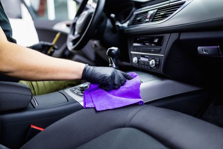 A Man Cleaning Car Interior — Professional Car Wash in Norville, QLD