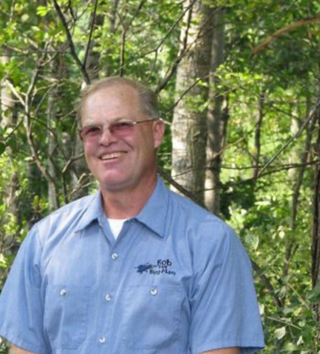 A man wearing a blue shirt that says 4cb on it