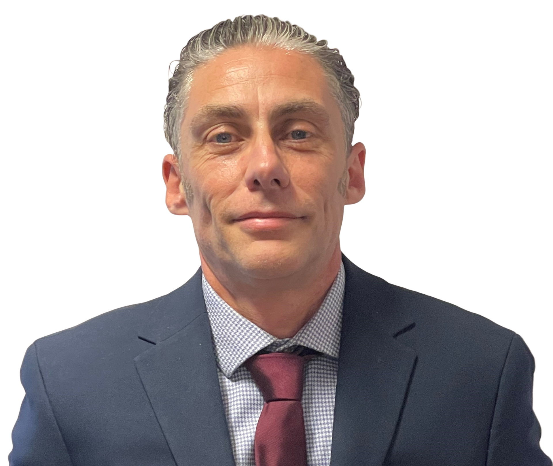 A man in a suit and tie is smiling for the camera.