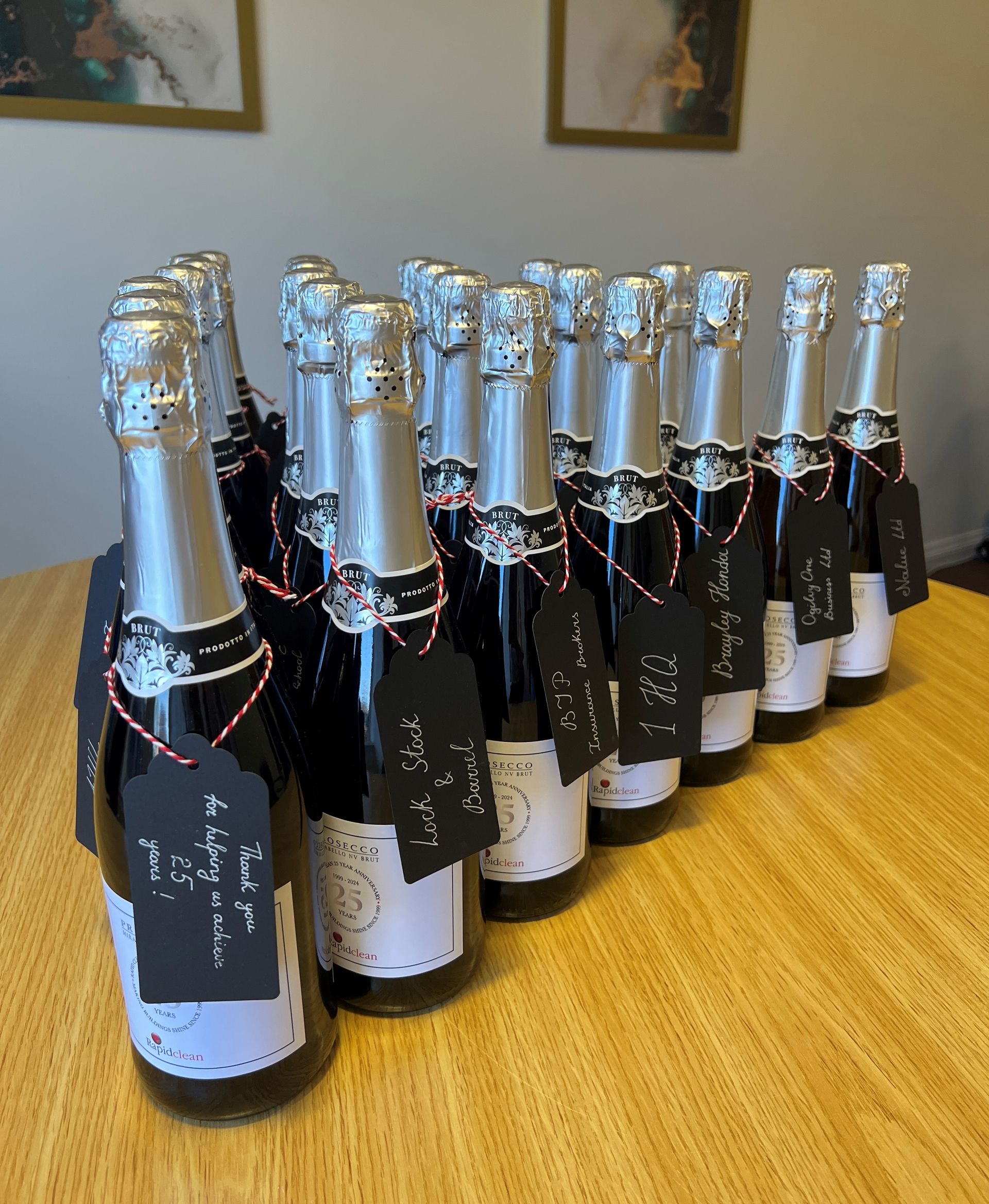 25 year celebration with bottles of commemorative champagne on a table