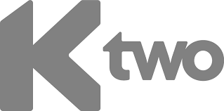 The k two logo is a gray and white logo on a white background.