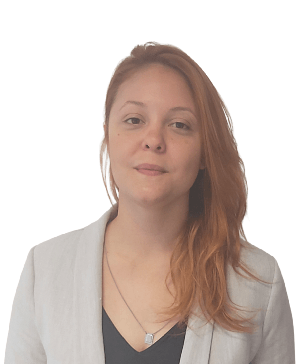 A woman with red hair is wearing a white jacket and a black shirt.