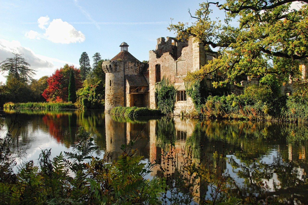 A castle is reflected in the water of a lake
