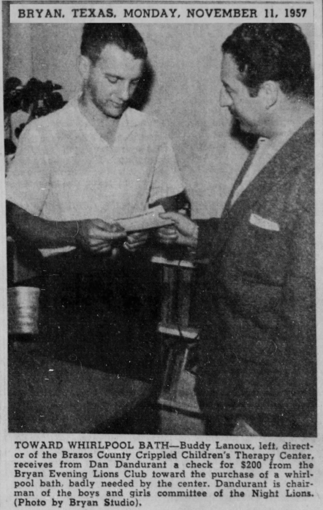 Man receiving check from another man towards whirlpool bath. Bryan, Texas, 1957.