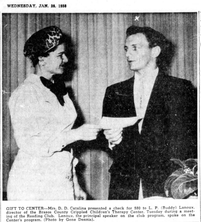 Woman in hat hands check to man in suit. Beacon, NY.