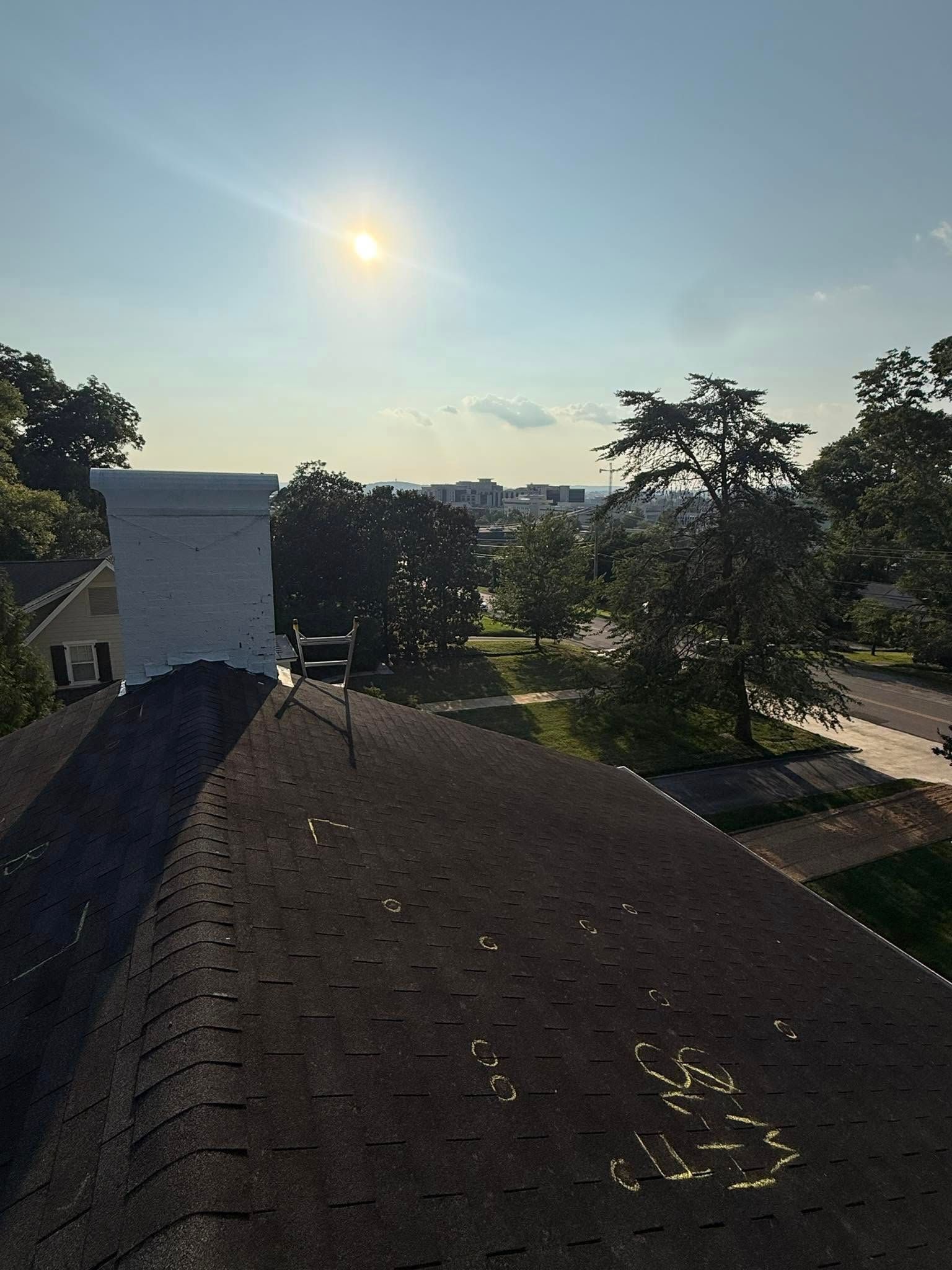 Circled Hail damage on a shingle roof in Huntsville, AL. Inspection shown by LJ Roofing & Exteriors