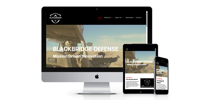 A computer , tablet , and cell phone are displaying a website for black bridge defense.