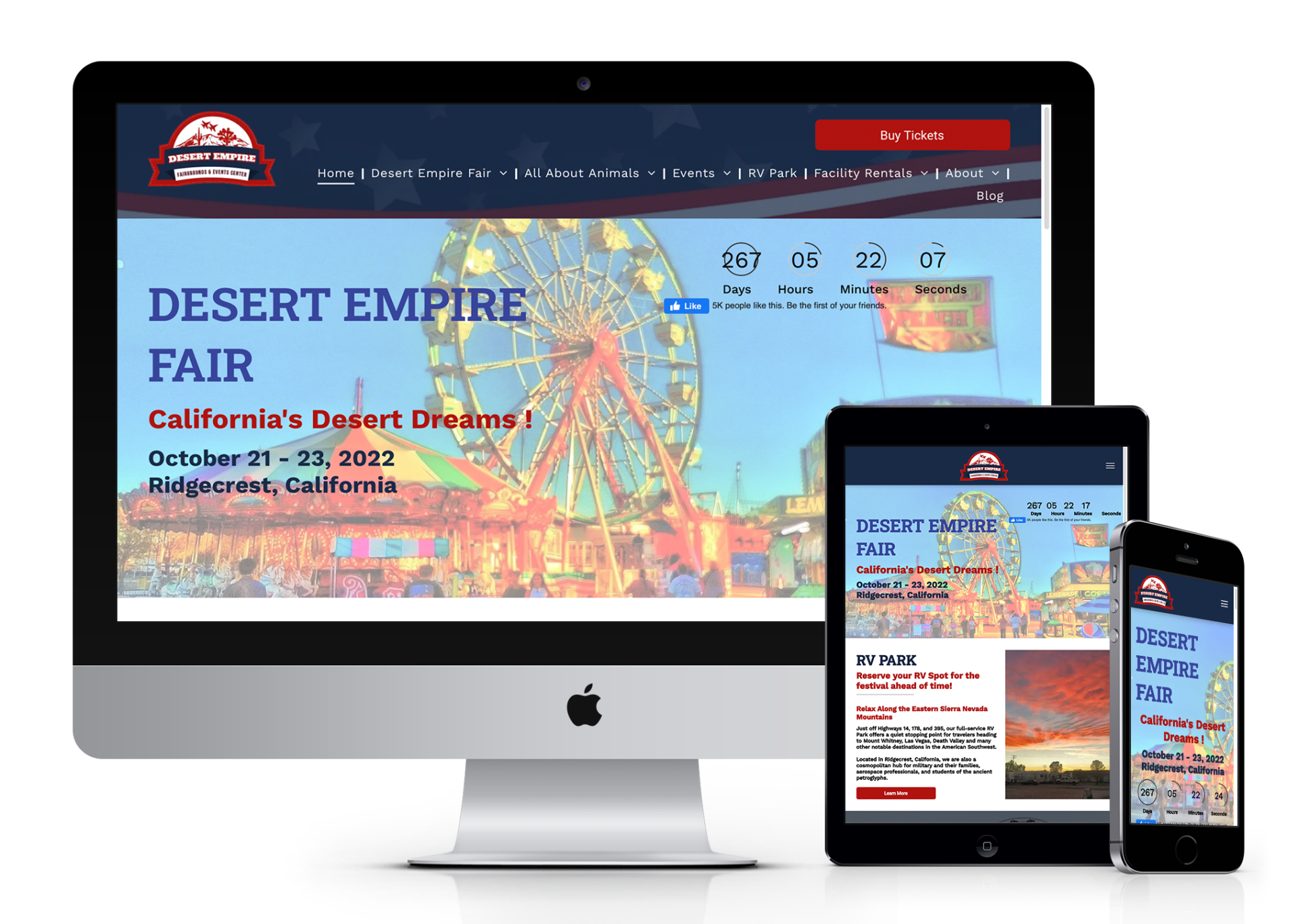 A computer , tablet , and cell phone are displaying a website for the desert empire fair.