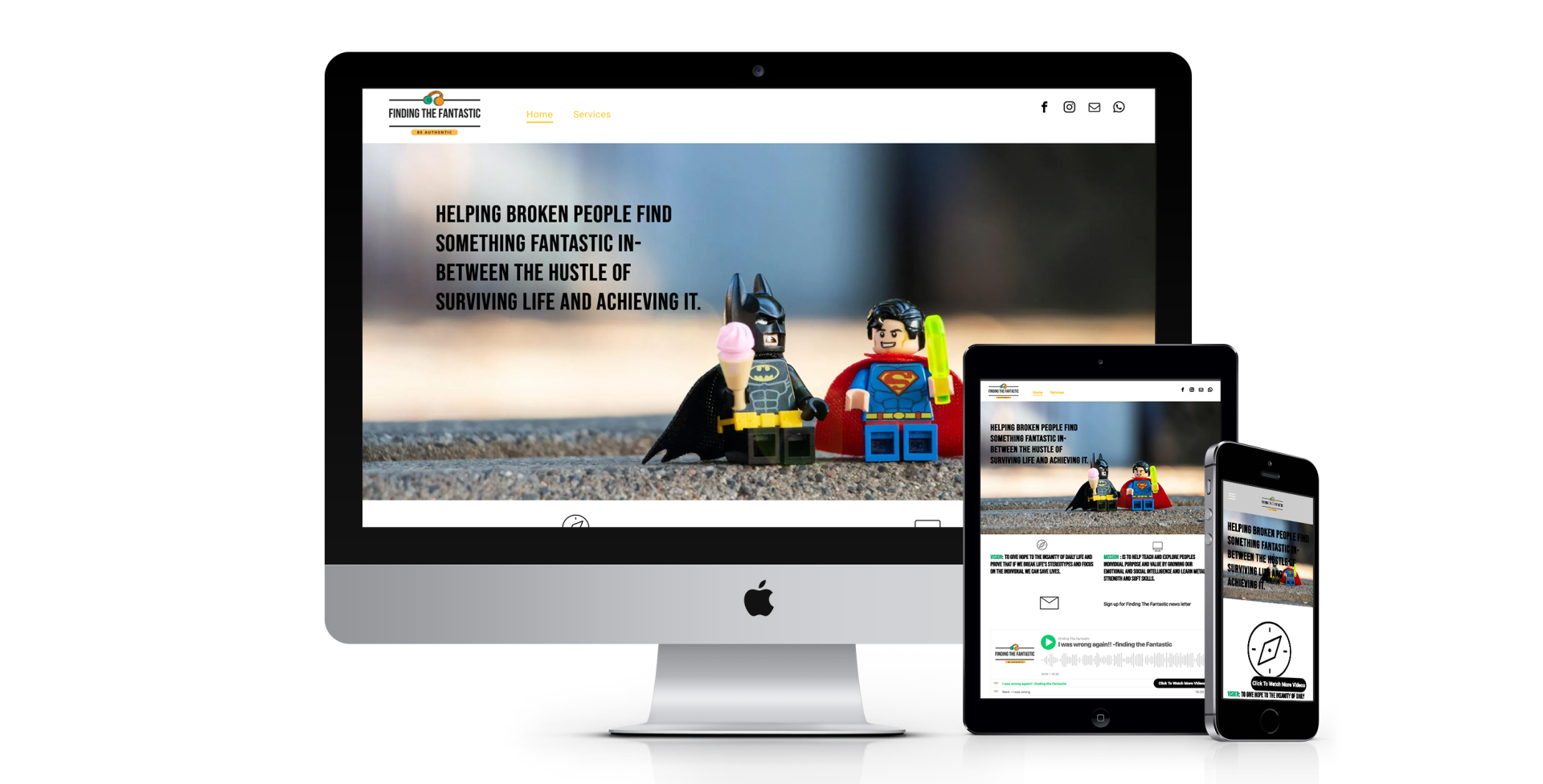 A computer monitor a tablet and a cell phone are displaying a lego batman and superman website.