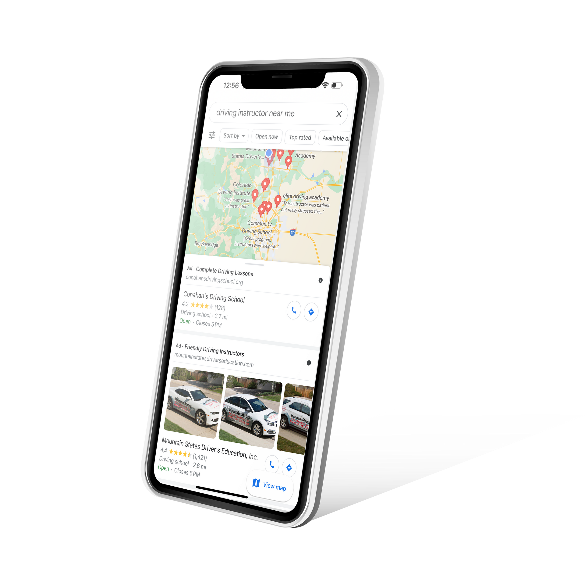 A cell phone is displaying a google map on its screen.
