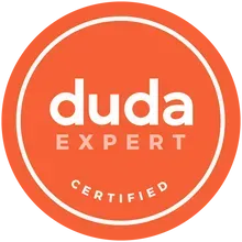The logo for duda expert is orange and white